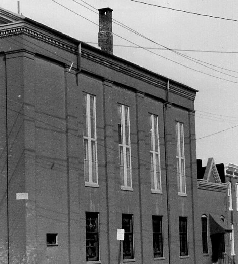 Side elevation detail of the church showing the rhythm of the tall windows.